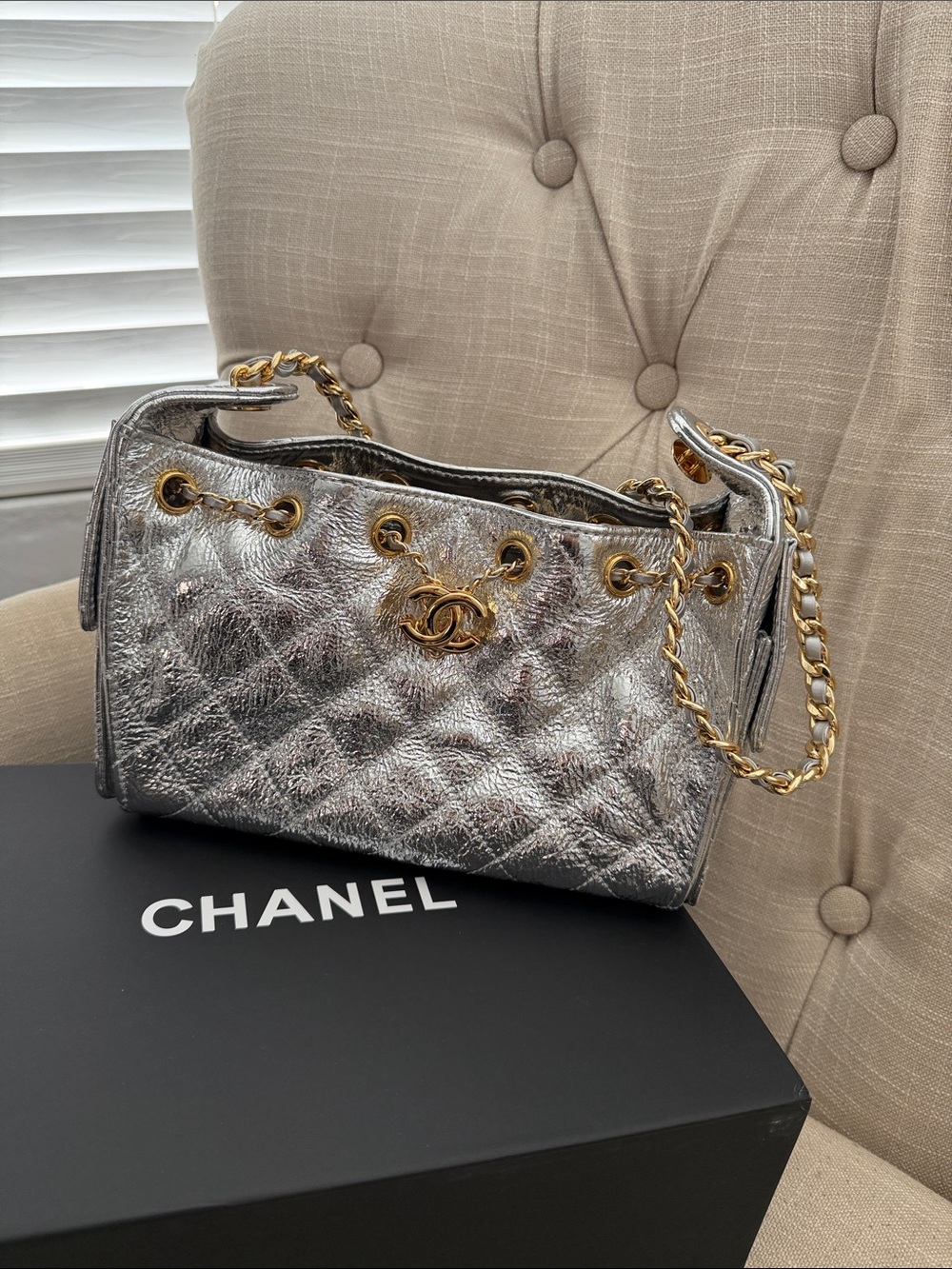 CHANEL 25C mini bucket crinkled silver leather with gold-metal hardware